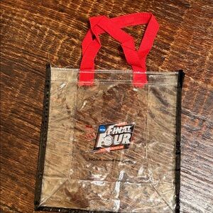 Clear Final Four Tote Bag with Red Handles and Black trim.